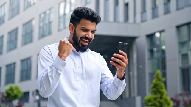 Man Cheering with Phone.