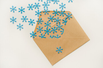 christmas tree made of paper. An envelope with snowflakes. Snowflakes in an envelope. Snowflakes flying out of the envelope.