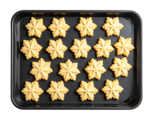 Snowflake-shaped cookies arranged on a dark baking sheet, overhead view.