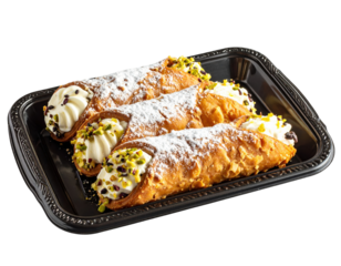Three Italian Cannoli Pastries with Cream, Pistachios, and Powdered Sugar on a Black Tray.