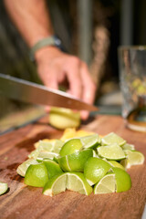 Mojito cocktail preparation with fresh lime and mint