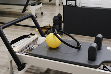 Equipment for pilates on reformers. No people. Empty gym space for training and sport activities 