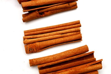Dried cinnamon sticks arranged in a bundle.