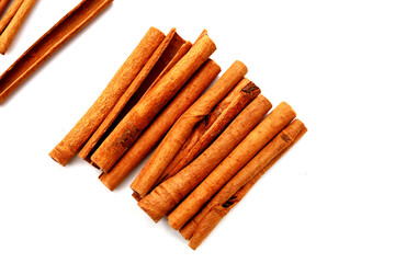 Dried cinnamon sticks arranged in a bundle.