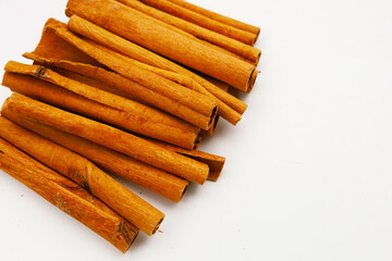 Dried cinnamon sticks arranged in a bundle.