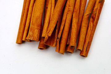 Dried cinnamon sticks arranged in a bundle.