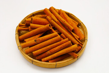 Dried cinnamon sticks arranged in a bundle.
