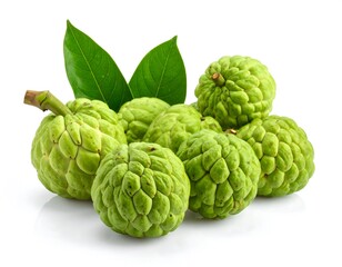 Obraz premium Close-up of green, textured custard apples with green leaves against a plain white background