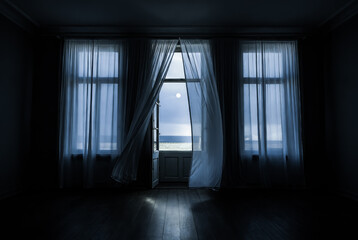The wind from the window flutters the curtains in the old house in the moonlight.