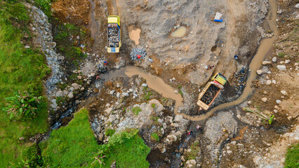 Mine Work of Dump Trucks in Rock Quarry with workers, Construction and mining site view from above 