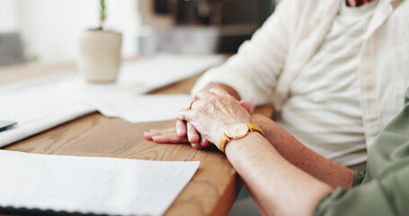 Obraz premium Holding hand, documents and senior couple in house with application for retirement home together. Love, compassion and elderly people for will paperwork with marriage, trust and care in apartment.