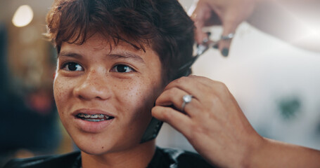 Hands, kid and service at hair salon for haircut, grooming or texture maintenance with flare. Teen,...