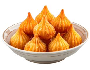 Golden Modaks in a Bowl: Traditional Indian Sweet Treats for Festive Occasions
