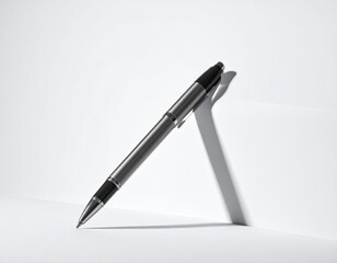 Sleek pen rests against a bright white corner