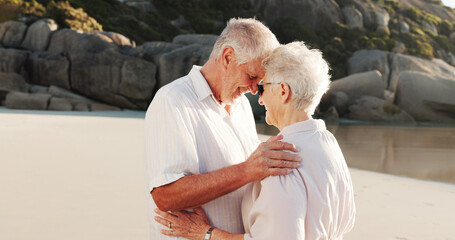 Senior couple, hug and beach with love for retirement holiday, weekend or outdoor getaway together. Elderly, man and woman with smile or embrace on ocean coast for summer romance or date in nature