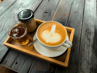 Hot coffee. Holding a hot latte in a mug from the cafe.