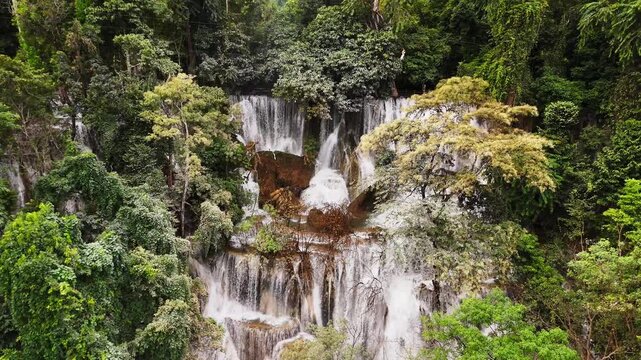 Turquoise Pools and Tropical Jungle Scenery. Turquoise cascading pools and lush jungle scenery at the Kuang Si Waterfalls near Luang Prabang, Laos.