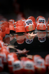 Small red Daruma dolls in Katsuoji Temple. A Traditional red Daruma doll is used as a symbol of determination in Japanese culture at Katsuo-ji temple, Osaka, Japan