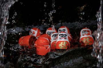 Small red Daruma dolls in Katsuoji Temple. A Traditional red Daruma doll is used as a symbol of determination in Japanese culture at Katsuo-ji temple, Osaka, Japan