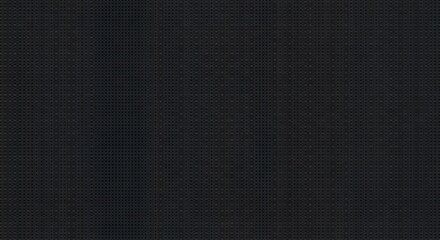 Dark background with small holes creates uniform texture suitable for various design applications and provides subtle visual interest