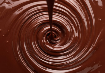 Smooth melted chocolate pouring and swirling, decadent sweet treat