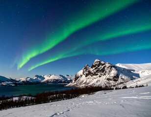 Majestic night sky illuminated by northern lights over snowy mountains