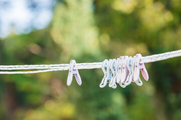 Clothespins on a Clothesline with Rain Droplets