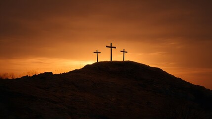 Obraz premium Three Crosses Silhouetted Against a Dramatic Sunset Sky.