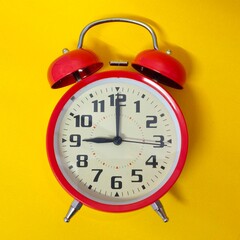 Close-up of a red twin bell alarm clock. Isolated. Concept of time. Copy space.