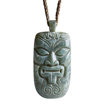 Front view of a Maori hei tiki carved greenstone necklace floating in the air, studio shot, isolated on a white transparent background