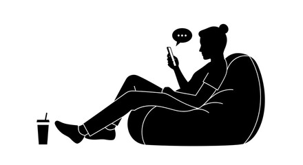 Silhouette of a person relaxing in a beanbag chair while using a smartphone