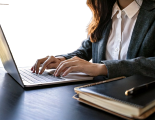 Businesswoman Working on Laptop in Office