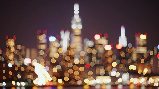Blurred of night city skyscraper and tower lights bokeh Soft Focus Metropolis Backgound wallpaper for movie or documentary romantic mood concept 4K 10s