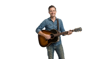 Man stands with guitar in hand, smiling and ready to perform in a studio setting during daylight hours