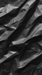 Close-up shot showcasing the unique texture and shadows on the black crumpled material surface.