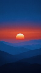 A bright sun crests over mountain silhouettes, casting orange glows over blue vistas at dusk.