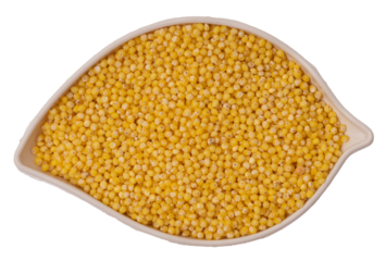 Isolated leaf-shaped container with millet on a white background