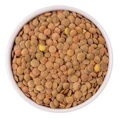 Isolated lentils in saucer on a white background