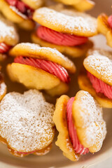 Lemon Spritz Cookie Sandwich with Cranberry Buttercream