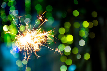 beautiful bokeh of christmas sparkler, holiday background and happy new year creating festive atmosphere for celebration or holiday event