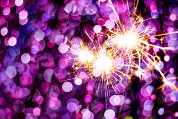beautiful bokeh of christmas sparkler, holiday background and happy new year creating festive atmosphere for celebration or holiday event