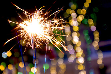beautiful bokeh of christmas sparkler, holiday background and happy new year creating festive atmosphere for celebration or holiday event