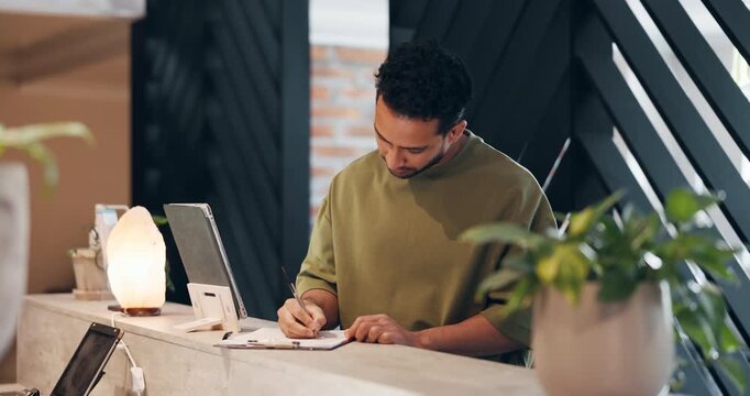 Spa, receptionist or man writing on form in lobby, personal details or treatment request document. Clipboard, contact info or people at front desk of wellness center, content protocol or disclaimer