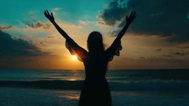 Embracing the Horizon: A silhouette of a woman with open arms welcomes the new day against a backdrop of a vibrant sunrise over the ocean, exuding hope and freedom.