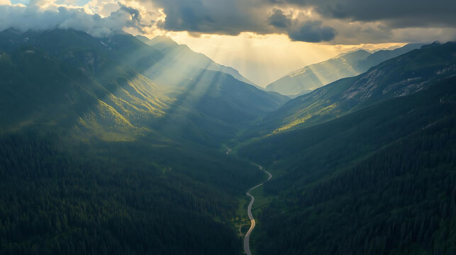 Majestic crepuscular rays illuminate a winding mountain valley covered in lush green forest