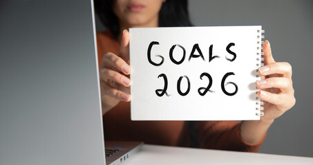 woman holding goals 2026 text