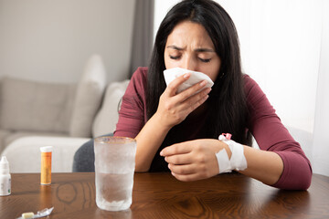 sick woman sneezing