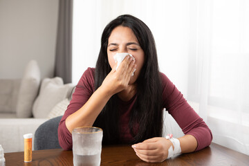 sick woman sneezing