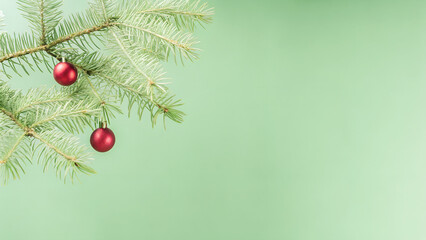 Minimal Christmas Pine Branch with Red Baubles on Green Background