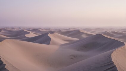 Vast desert landscape with rolling sand dunes under a soft, ethereal sky at dawn.